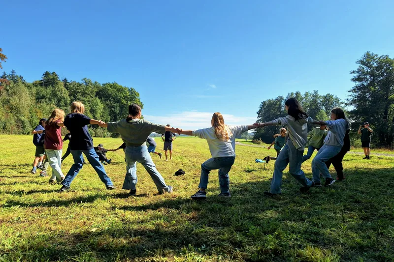 Children taking part in an outdoor activity at a summer camp.