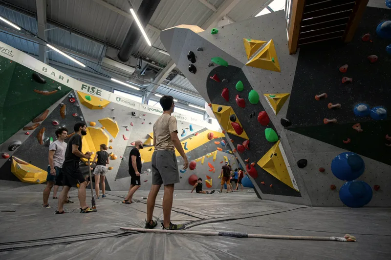 A climber on an indoor bouldering wall.