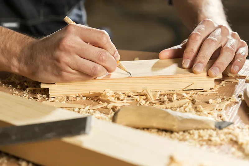 A workbench with hand tools in a maker workshop.